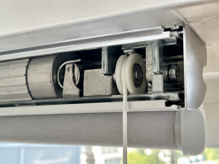 U-groove bearing pulley guiding wire through an industrial feeding device