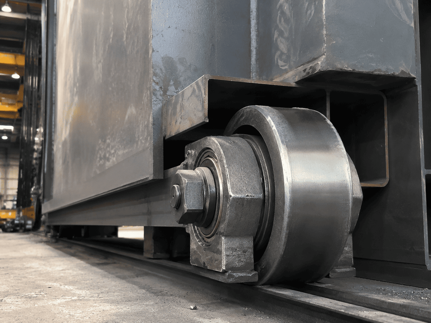 Heavy duty industrial door roller carrying a steel door